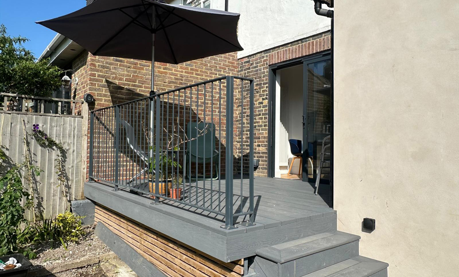Sunny private garden terrace with outdoor seating